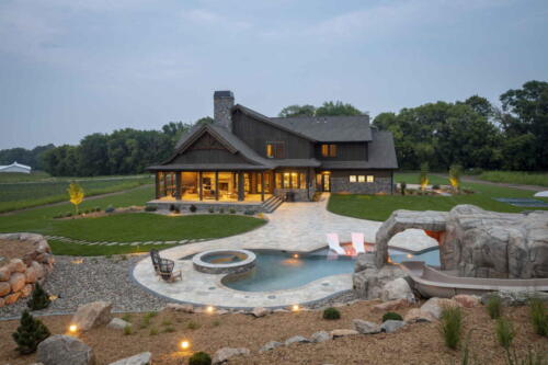 Custom Landscape with pool, spa, and waterfall features.